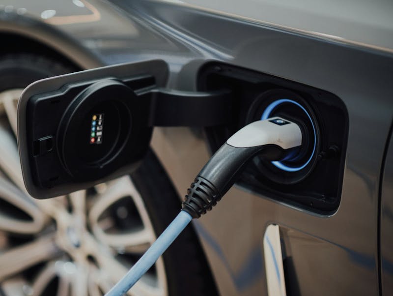 A person charging their car