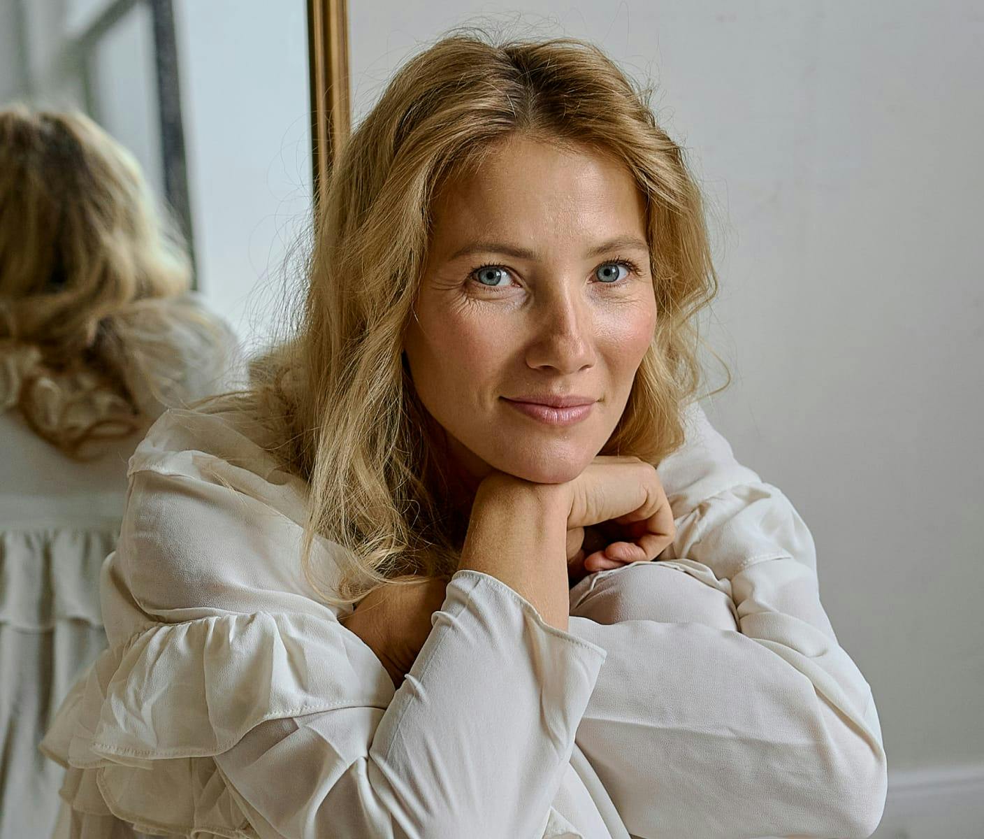 Woman resting her head on her wrist