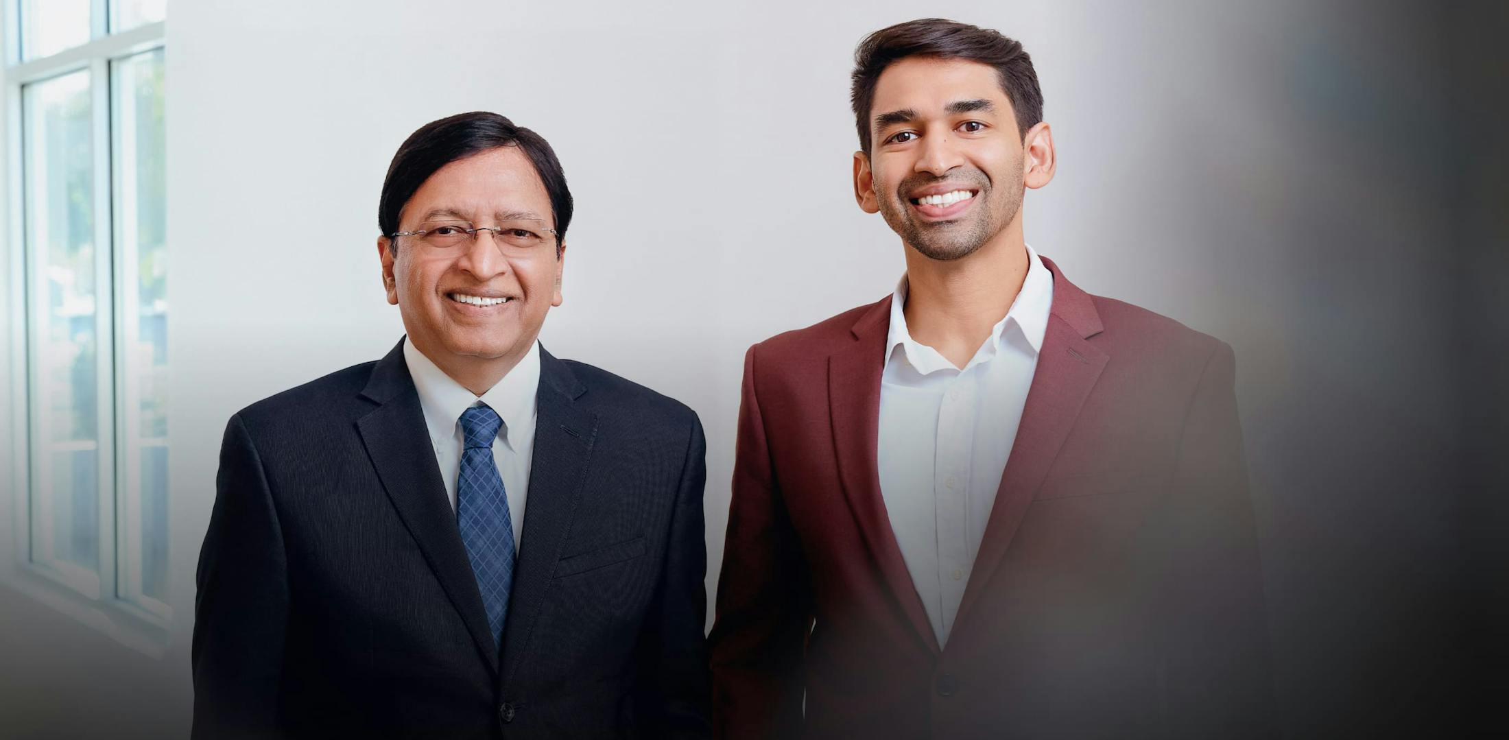 Dr. Vinod Jindal and Sumeet Jindal in suits