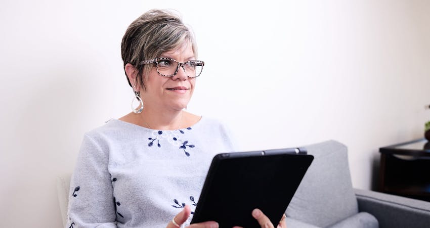 Woman holding clipboard