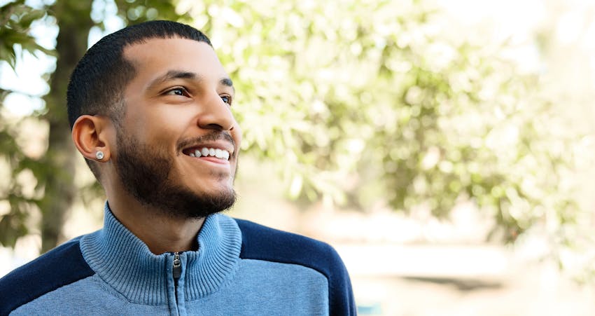 Man smiling outside