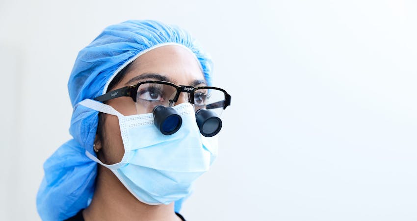 Doctor wearing eye equipment