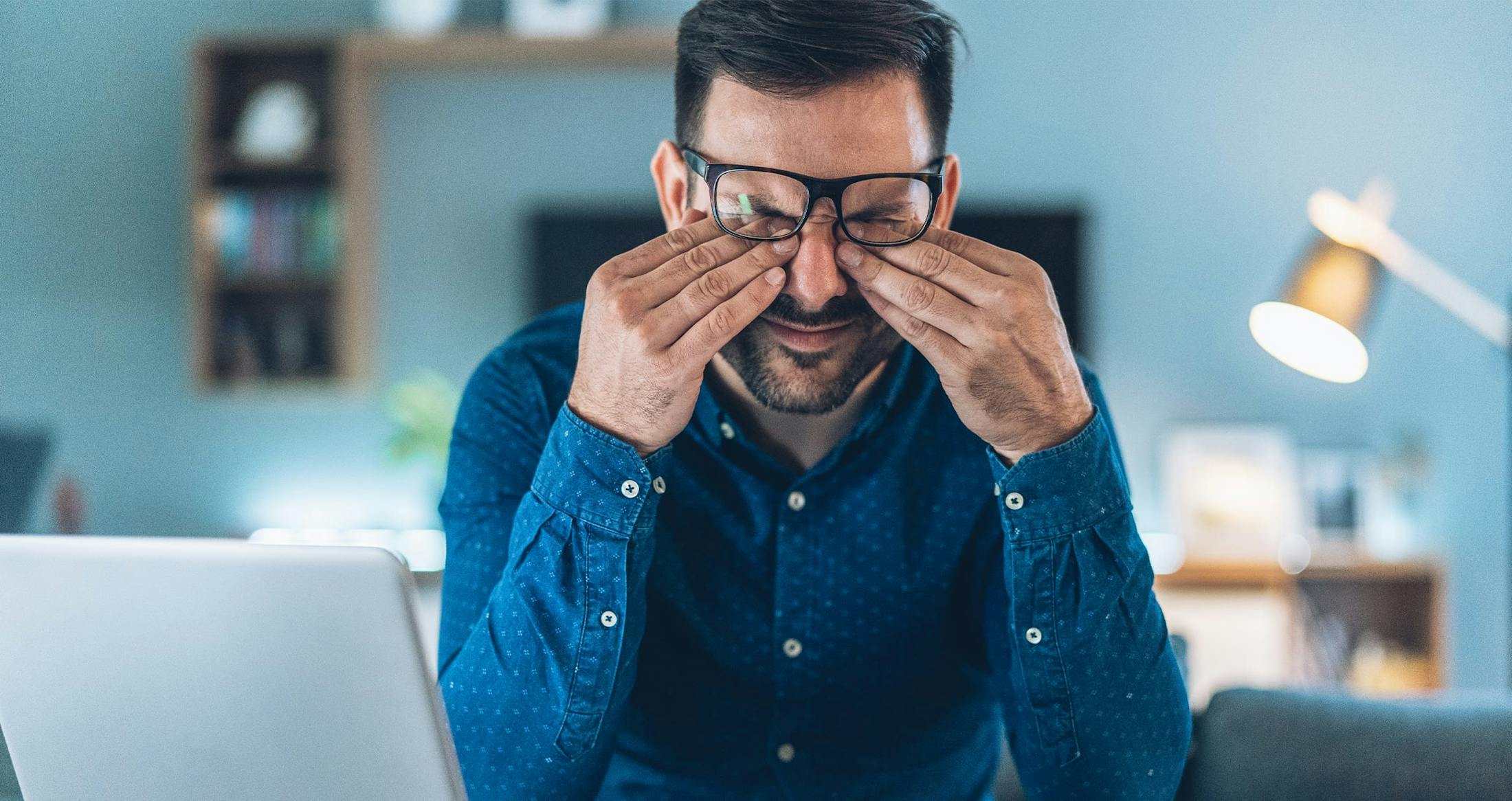 Man rubbing eyes