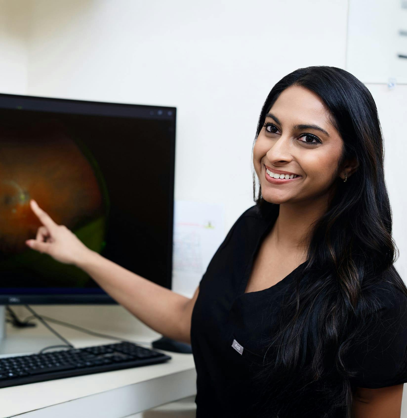 Doctor pointing to a screen