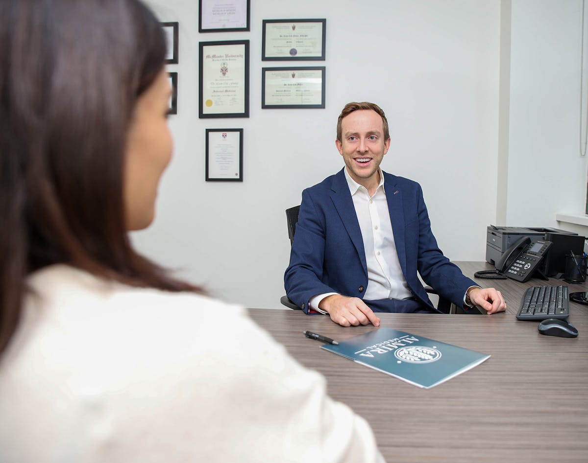 Dr. Liam Finlay doing a consult with a patient at Almira Medical