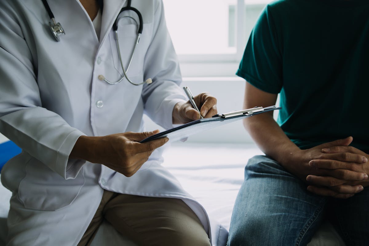Doctor reviewing medical history with patient
