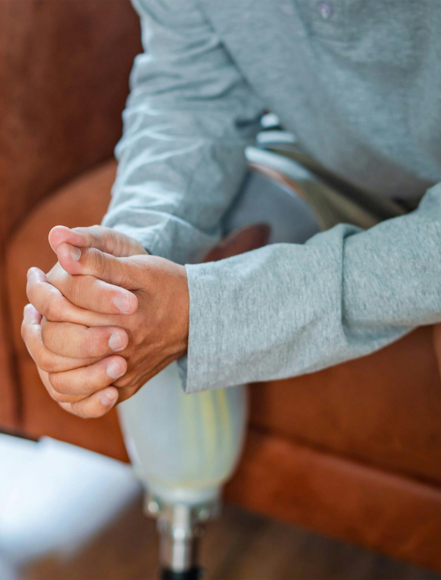 person with hands together