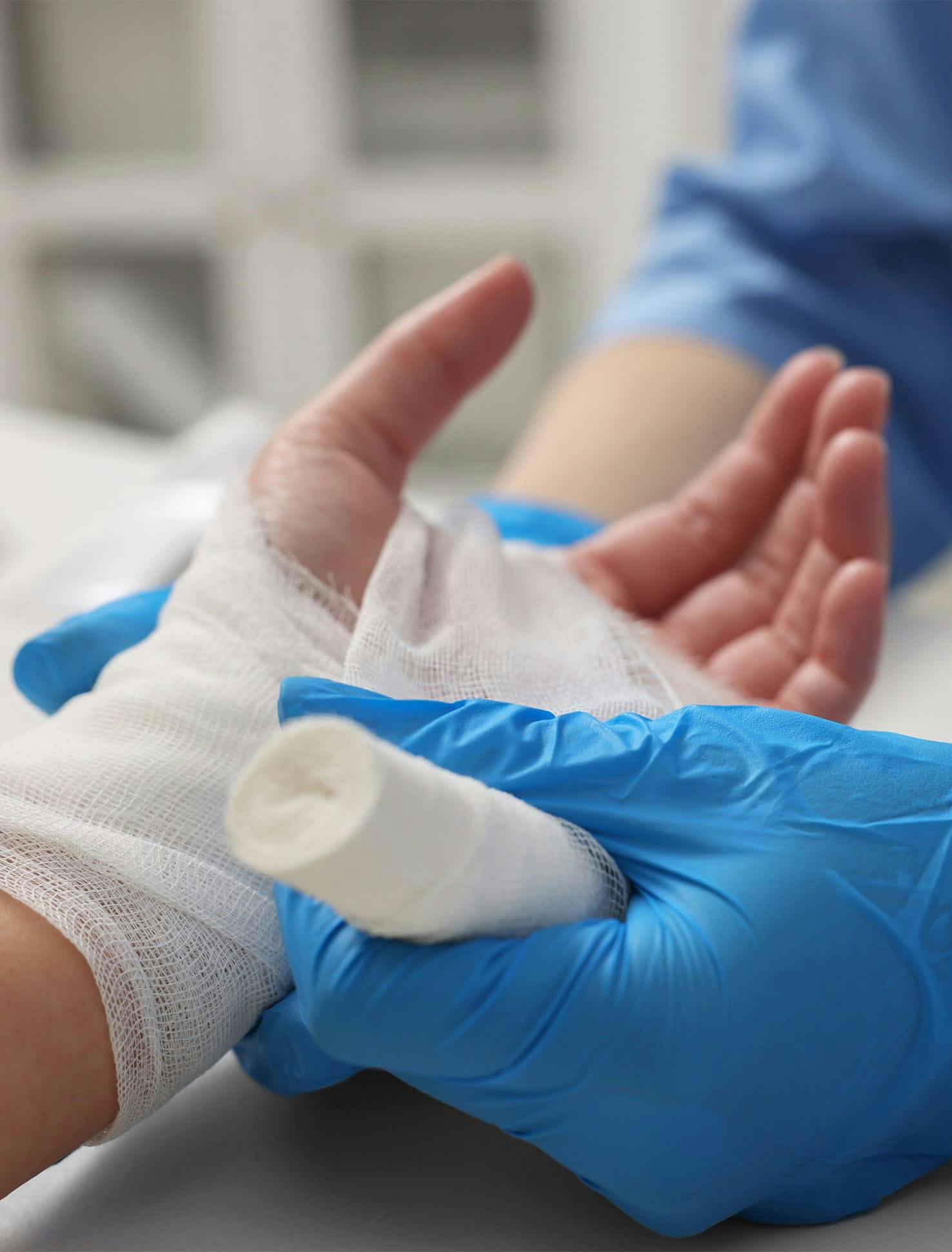 Hand getting bandaged up