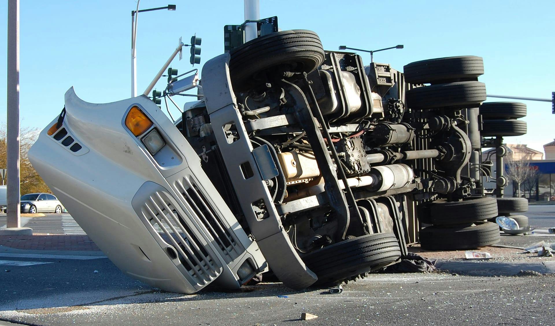 Truck overturned on its side.