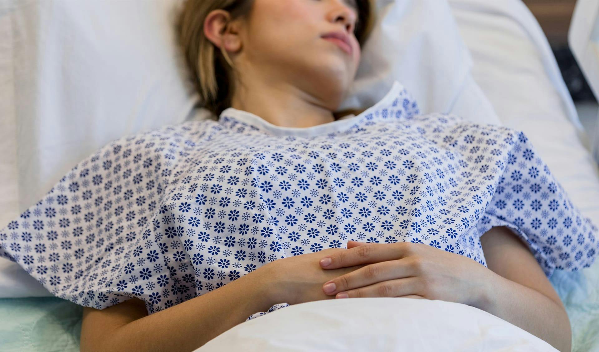 Woman in a hospital bed