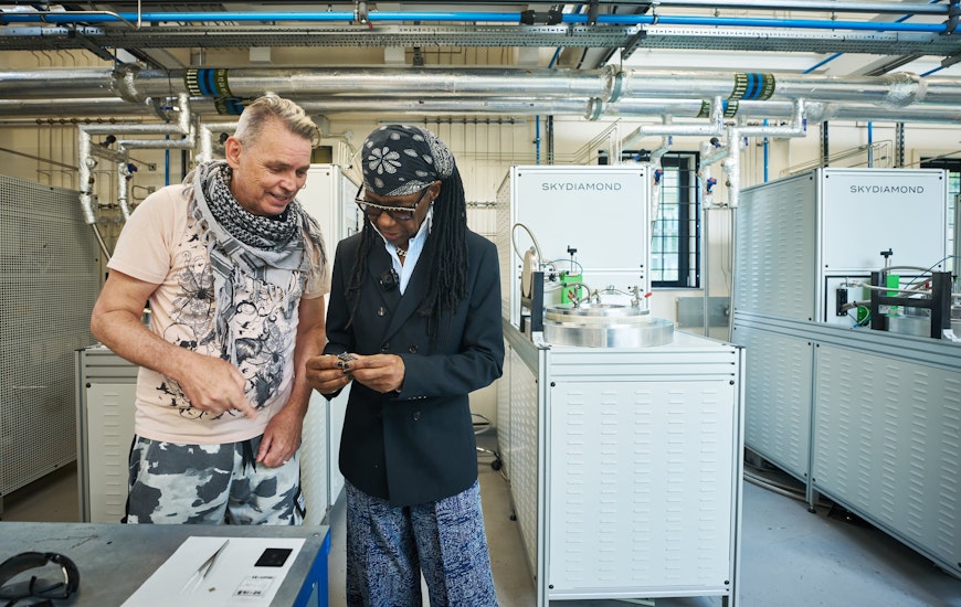 Nile Rodgers and Dale Vince inspecting diamonds