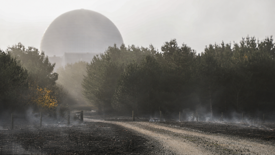 Sizewell C with ground smouldering outside (composite image)