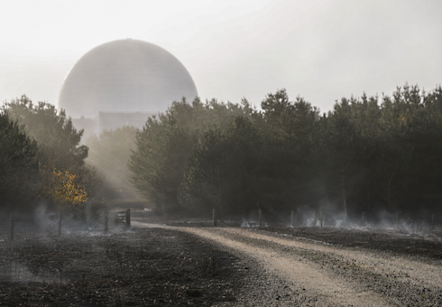 Sizewell C with ground smouldering outside (composite image)