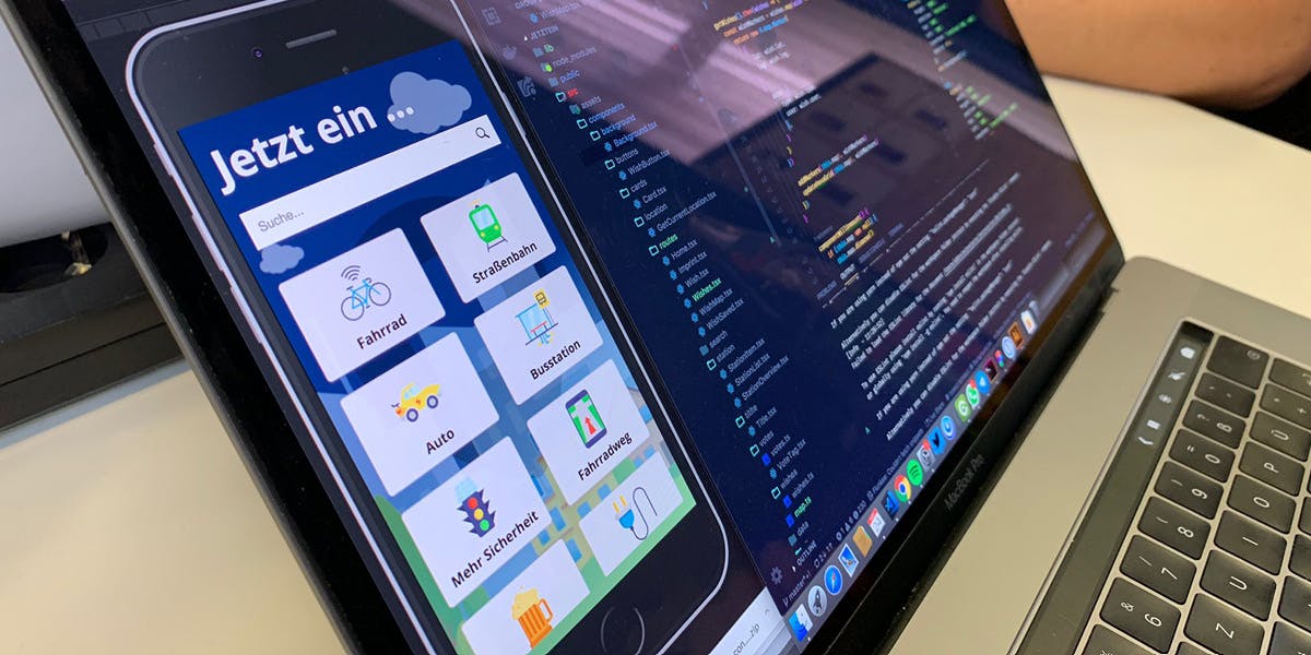 picture of a laptop screen where you can see an app preview and code