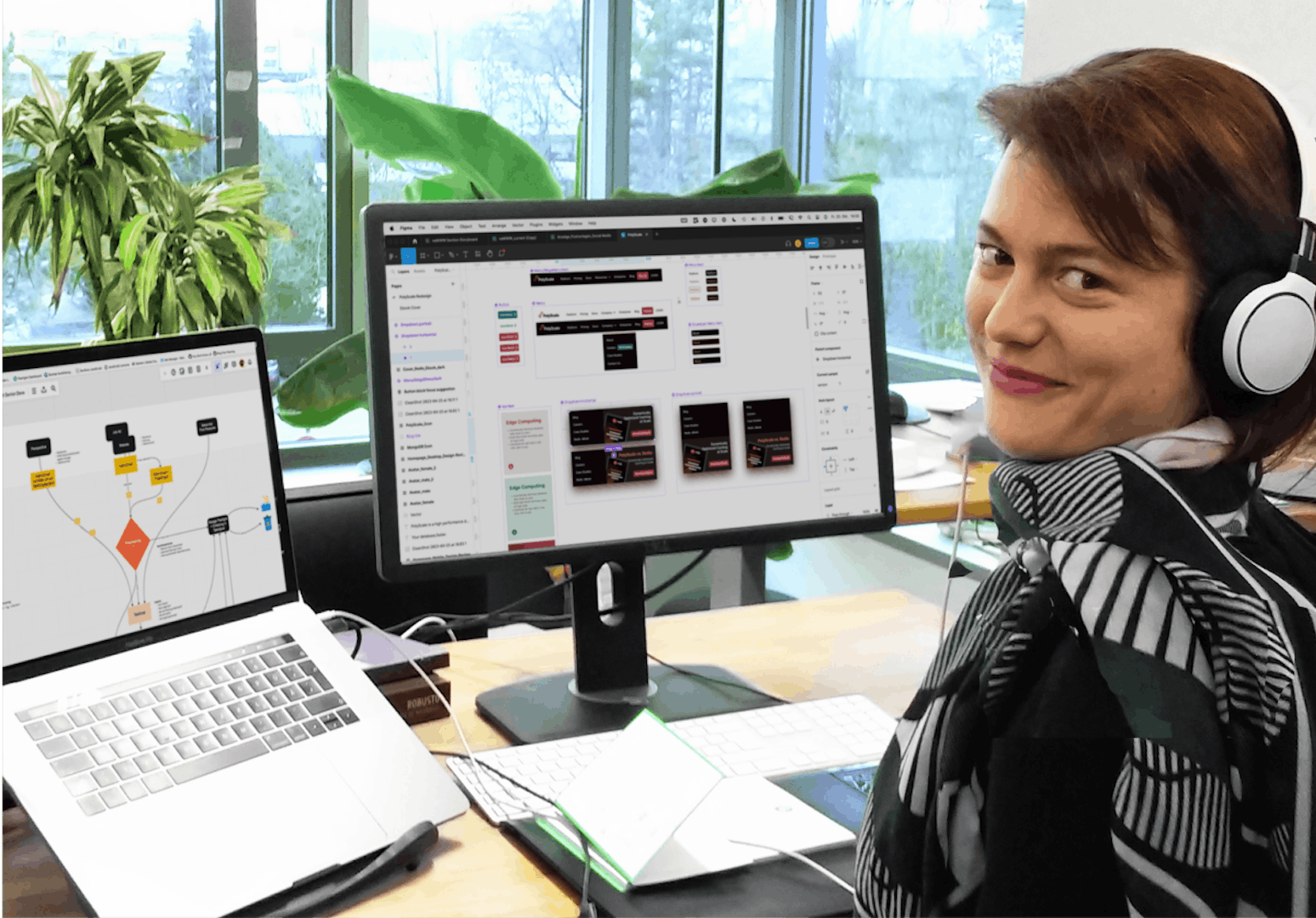UX Designer in front of two screens with Wireframes