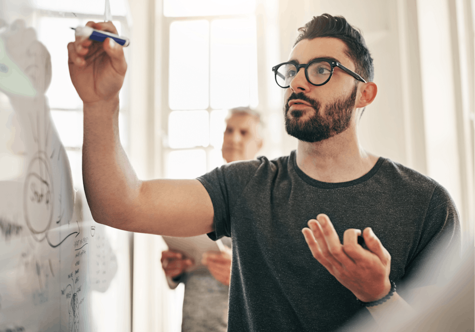 Designer holding a Design Sprint Workshop