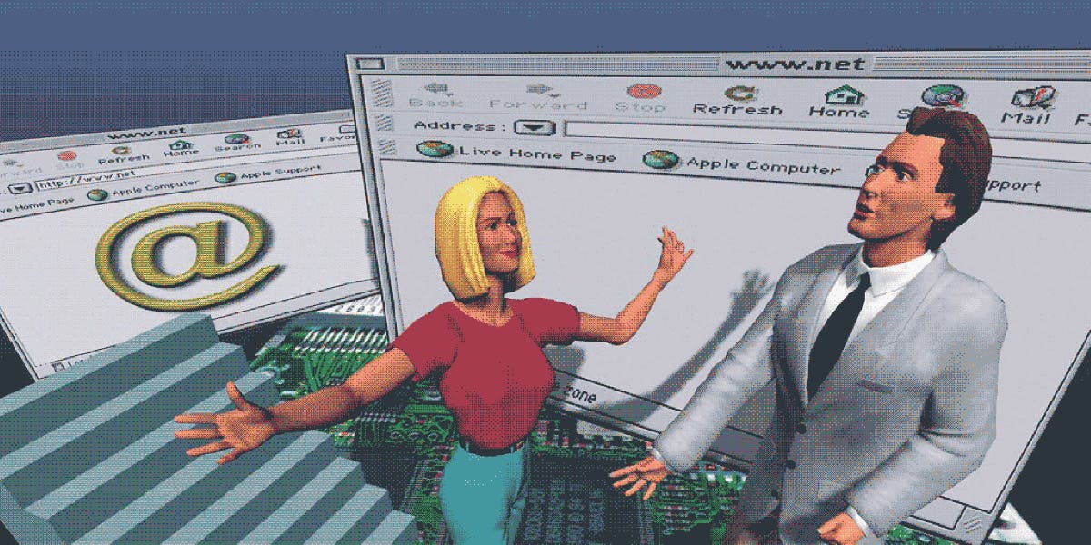 Two people presenting a website interface with email symbol and computer components displayed on screen