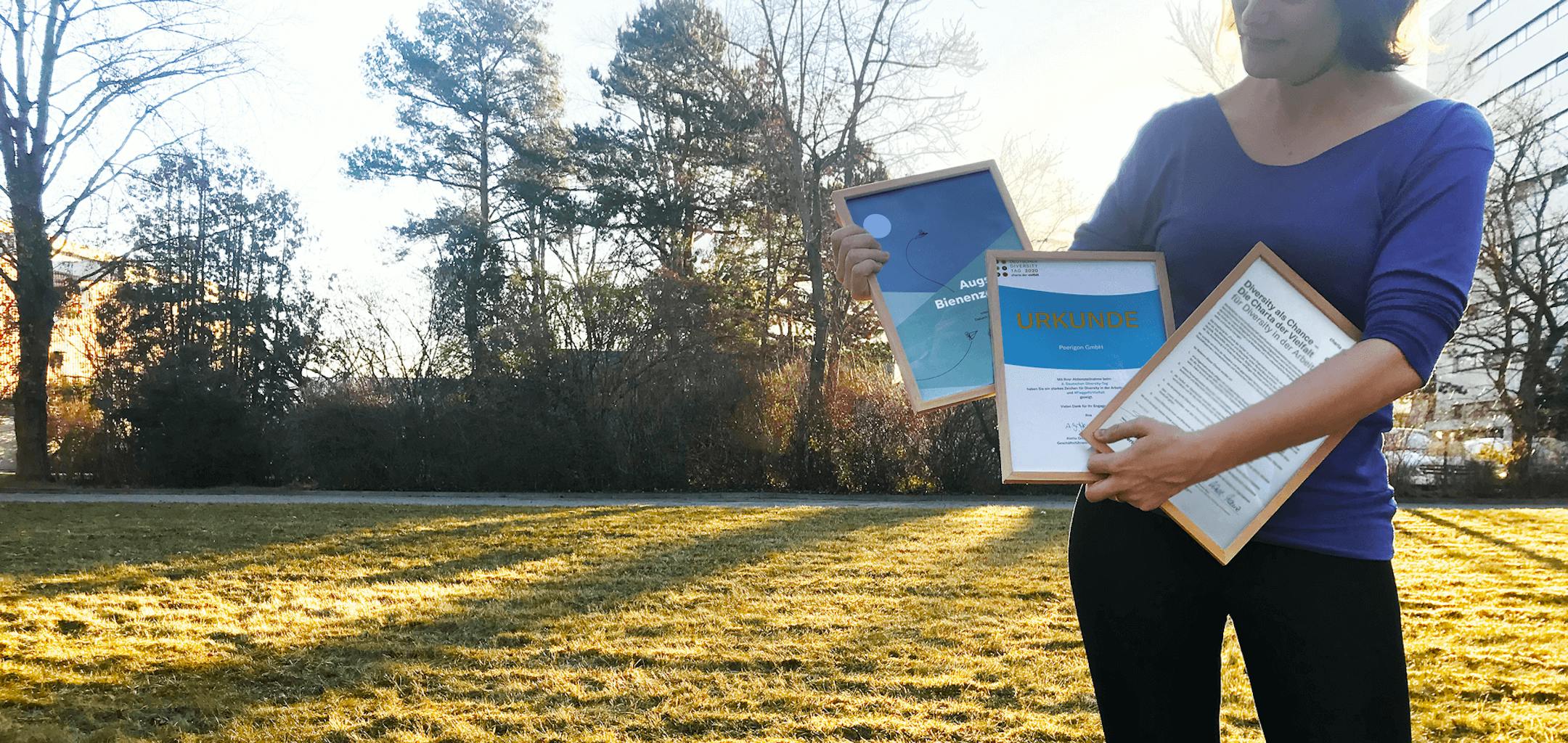 Woman holding sustainability certificates