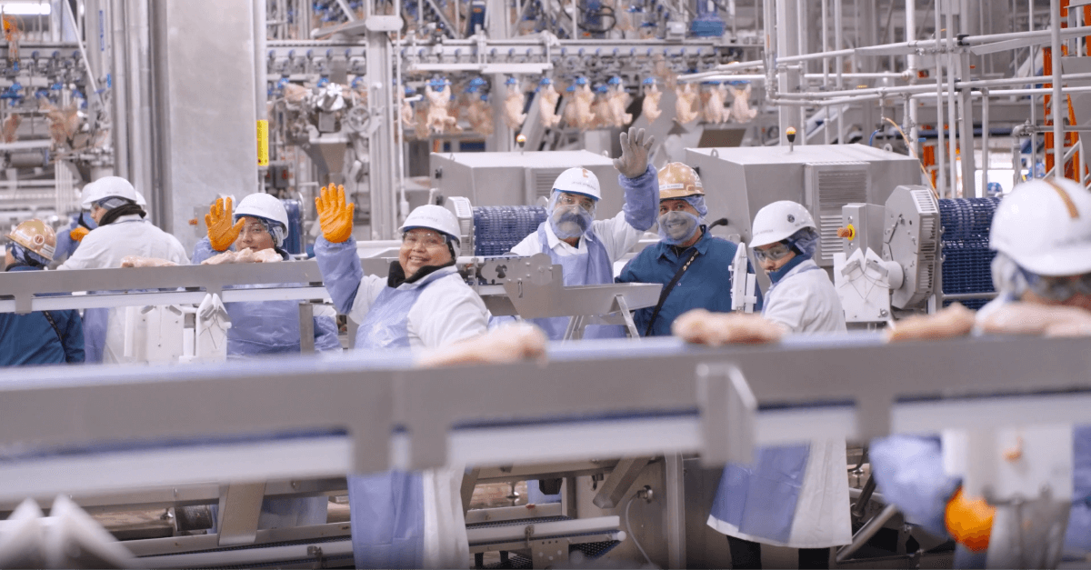Hero background Operators wave on the plant floor