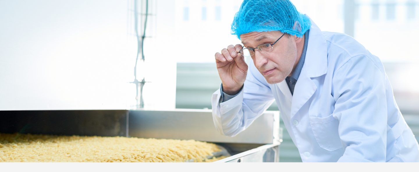 Man inspecting food in the facility.