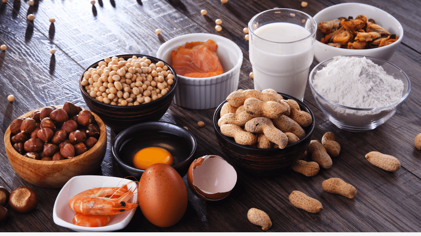 bowls and a glass of different common food allergens