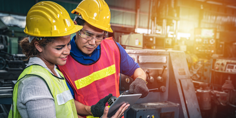 workers looking at tablet