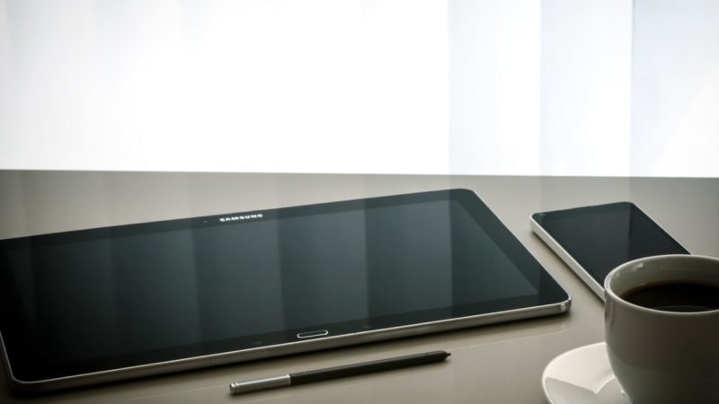pen, tablet, phone and coffee