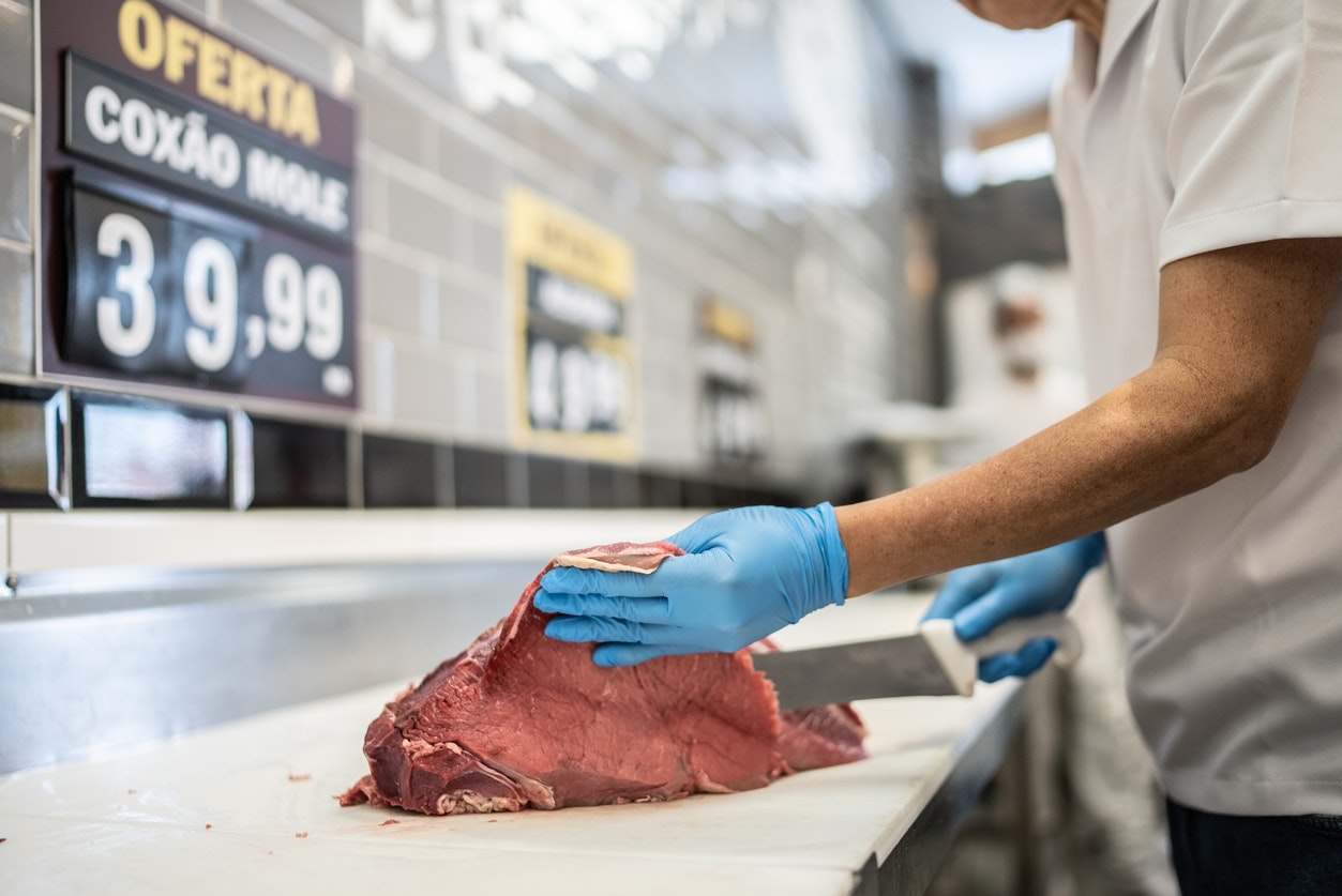 butcher carving meat
