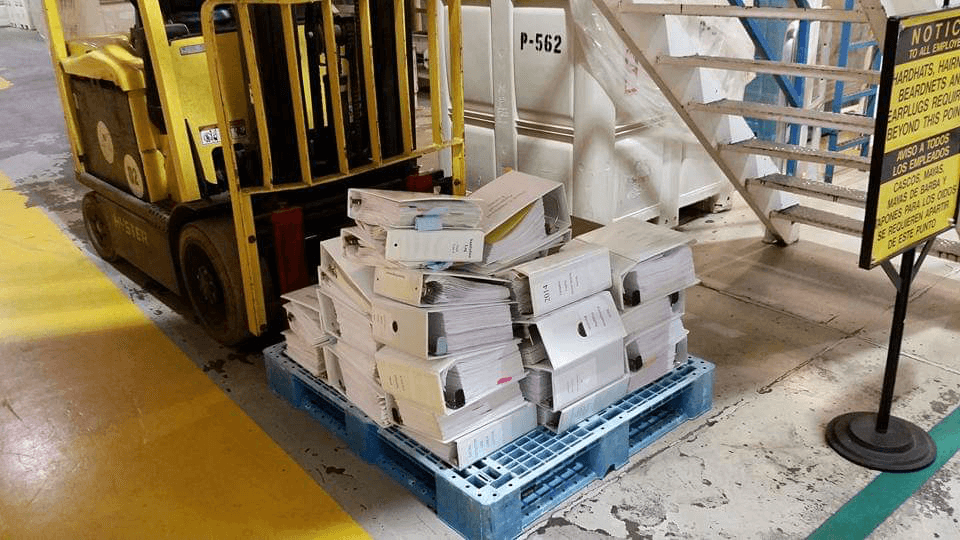 Nichols Farms old audit process. A palette full of binders with audit paperwork