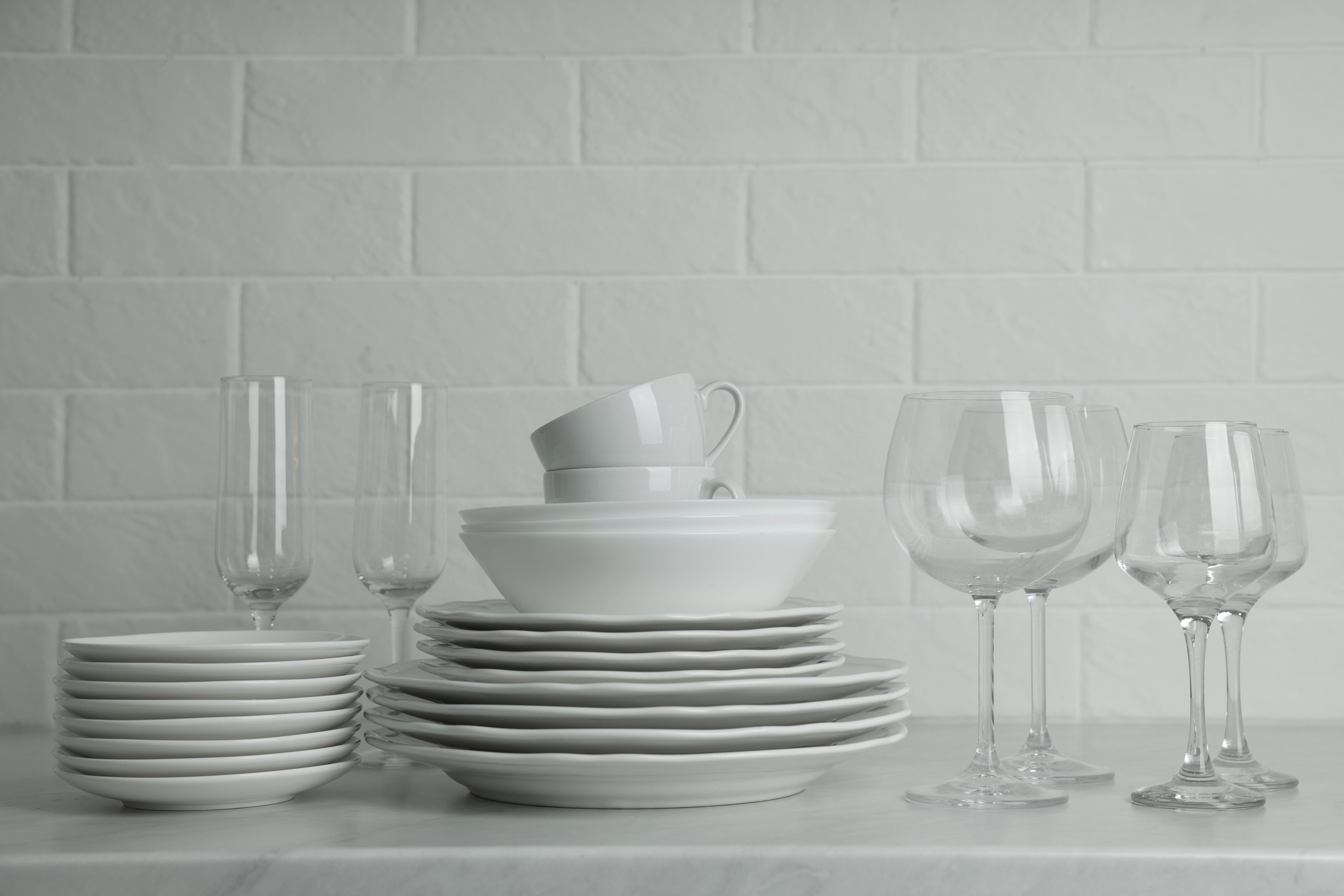 Stack of standardized white hospitality dinnerware