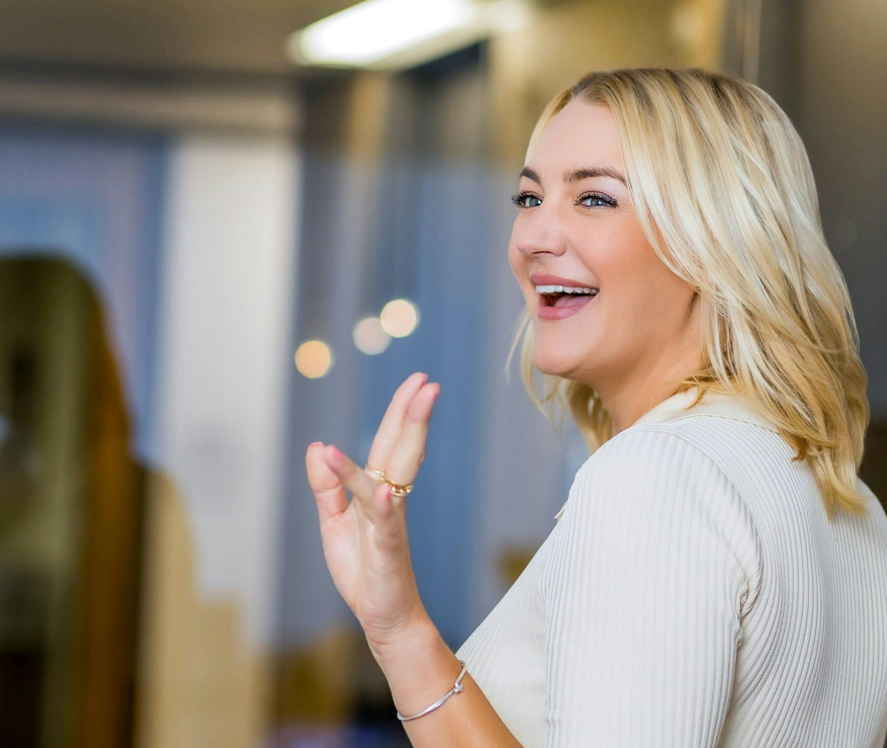 Patient waiving and smiling