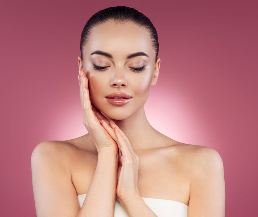 Woman with hands on cheek