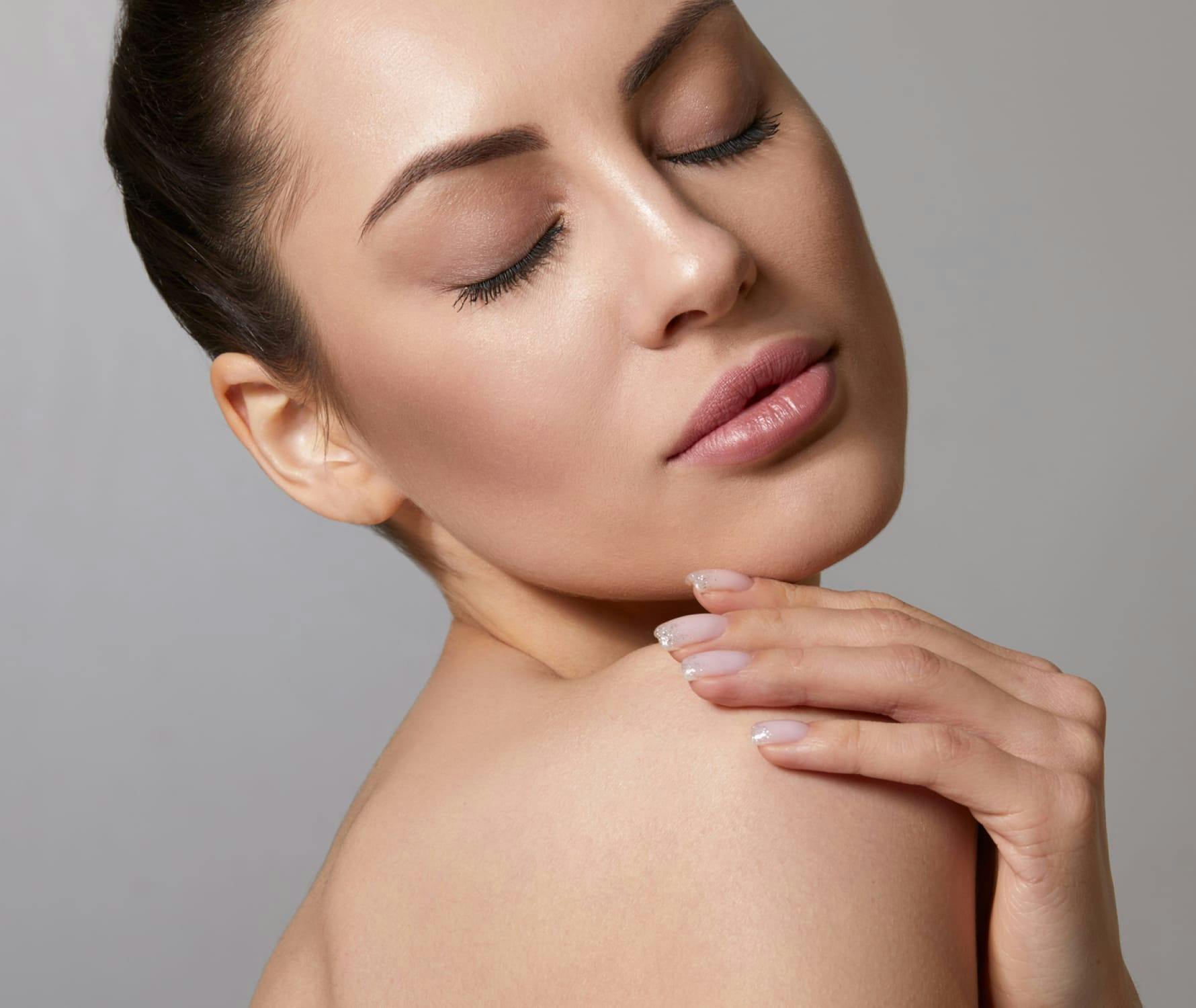 Woman rubbing shoulder