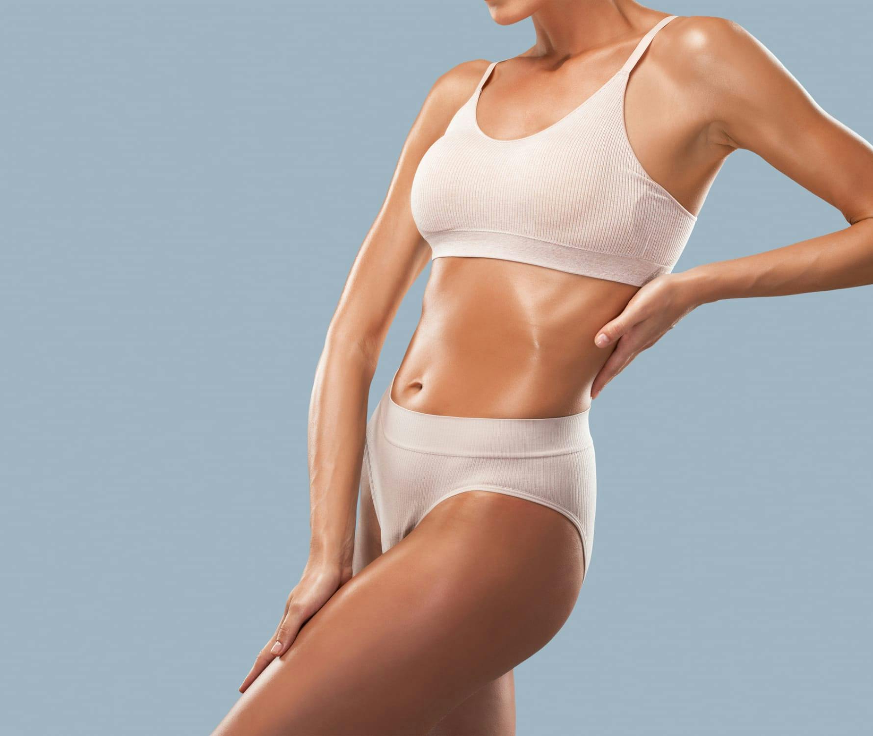 Oily woman posing midsection