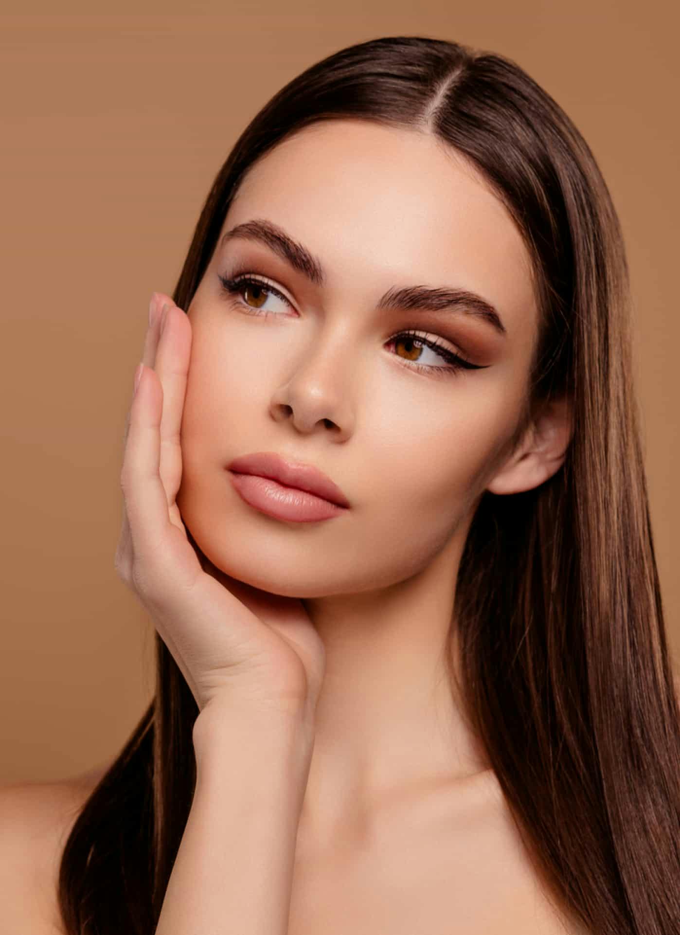 Woman touching cheek