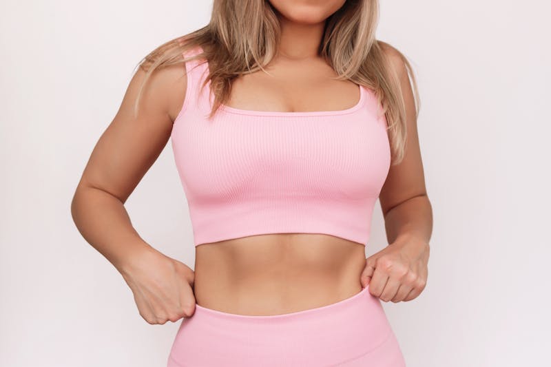 woman in pink workout set