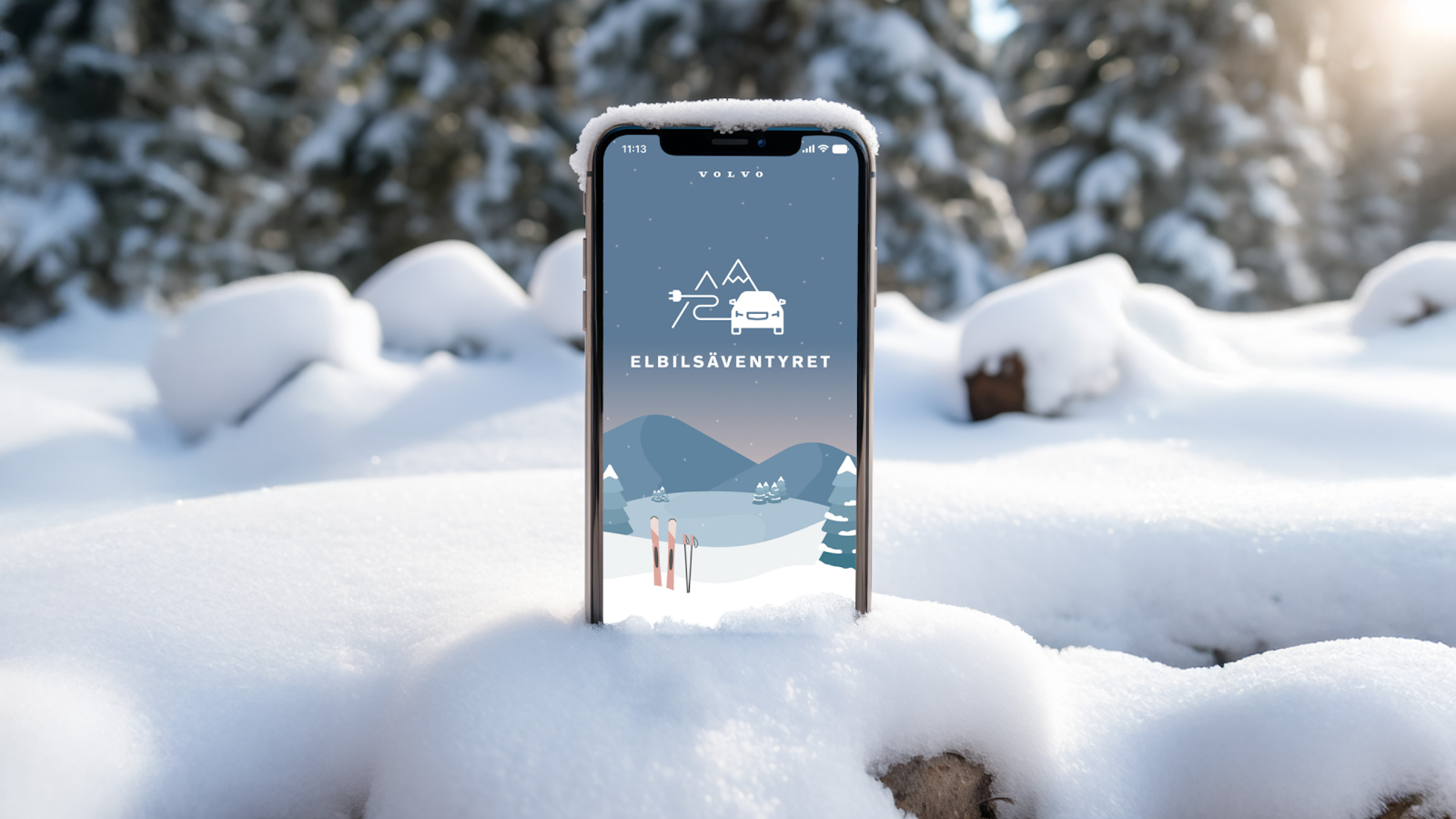 iPhone sticking out of the snow showing the entry screen of Elbilsäventyret.