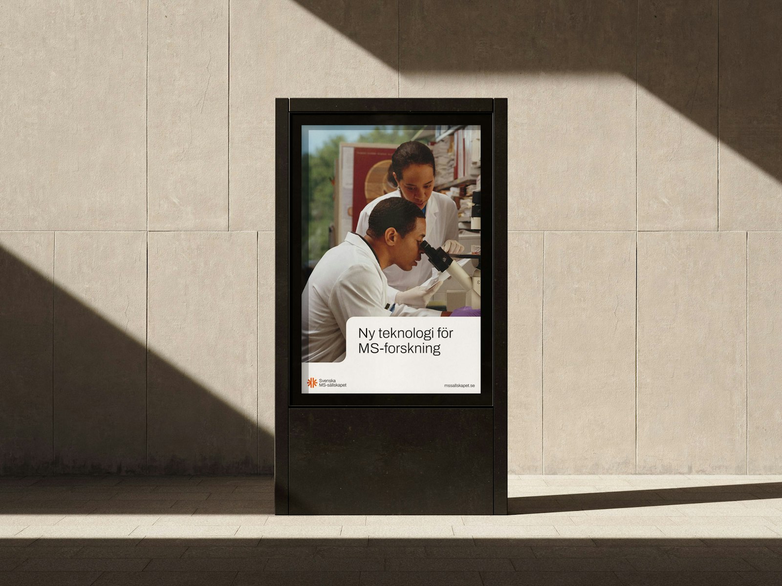 Poster promoting new technology for MS research, featuring two researchers examining data.