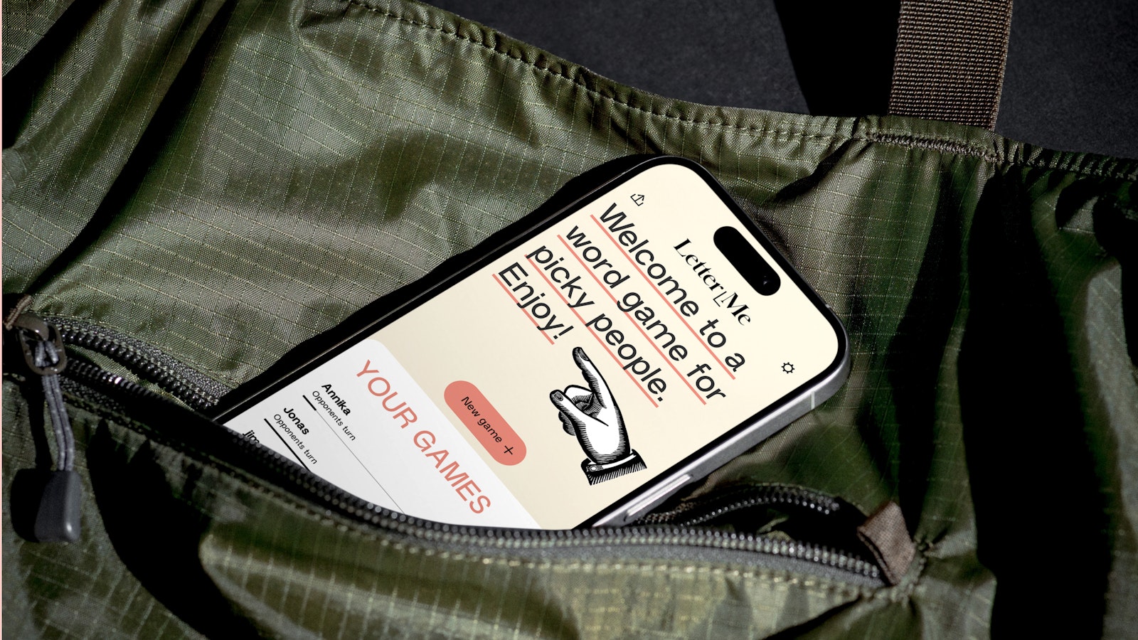 Smartphone displaying a game app inside a green bag.