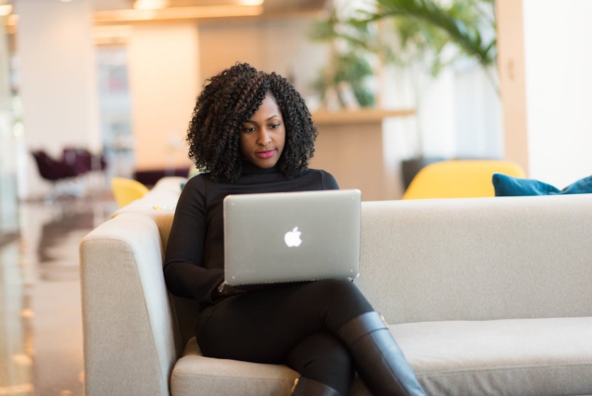 Woman typing on a laptop