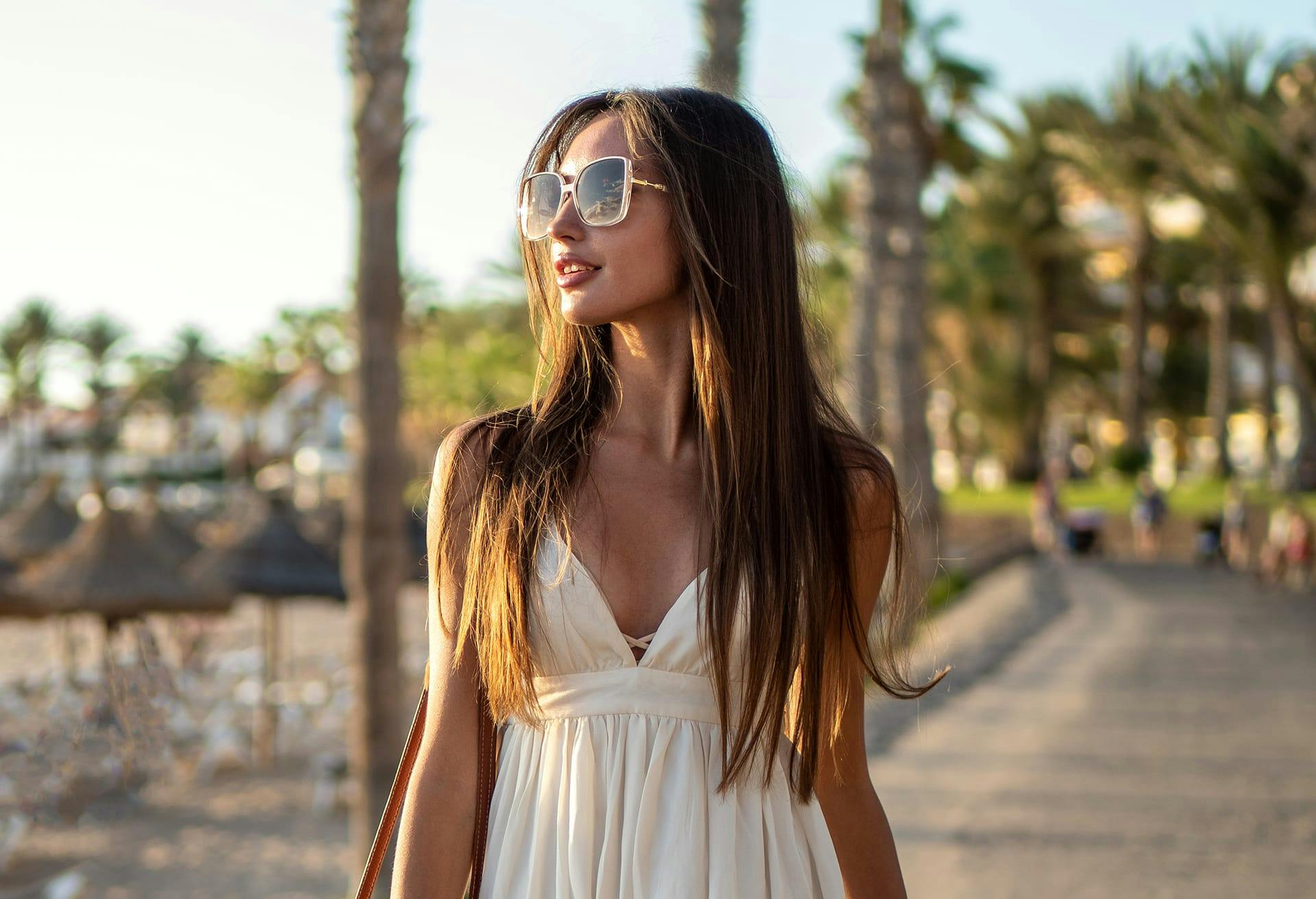 woman with sunglasses on walking