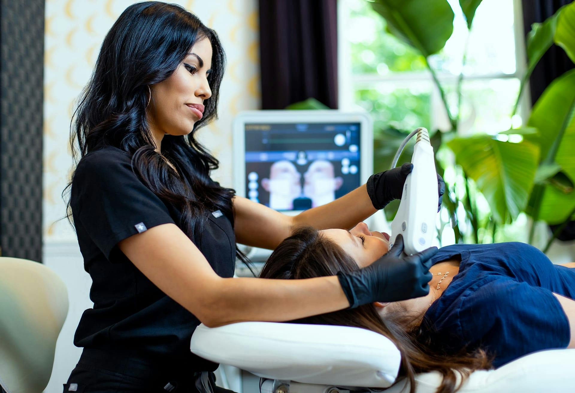 woman doing photofacial procedure on another woman