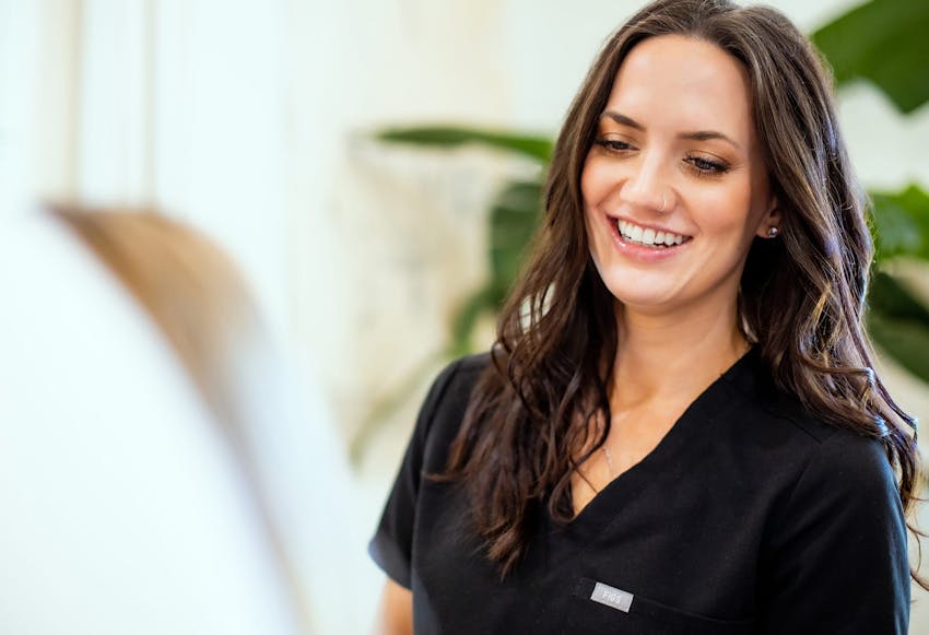 woman with brown hair smiling