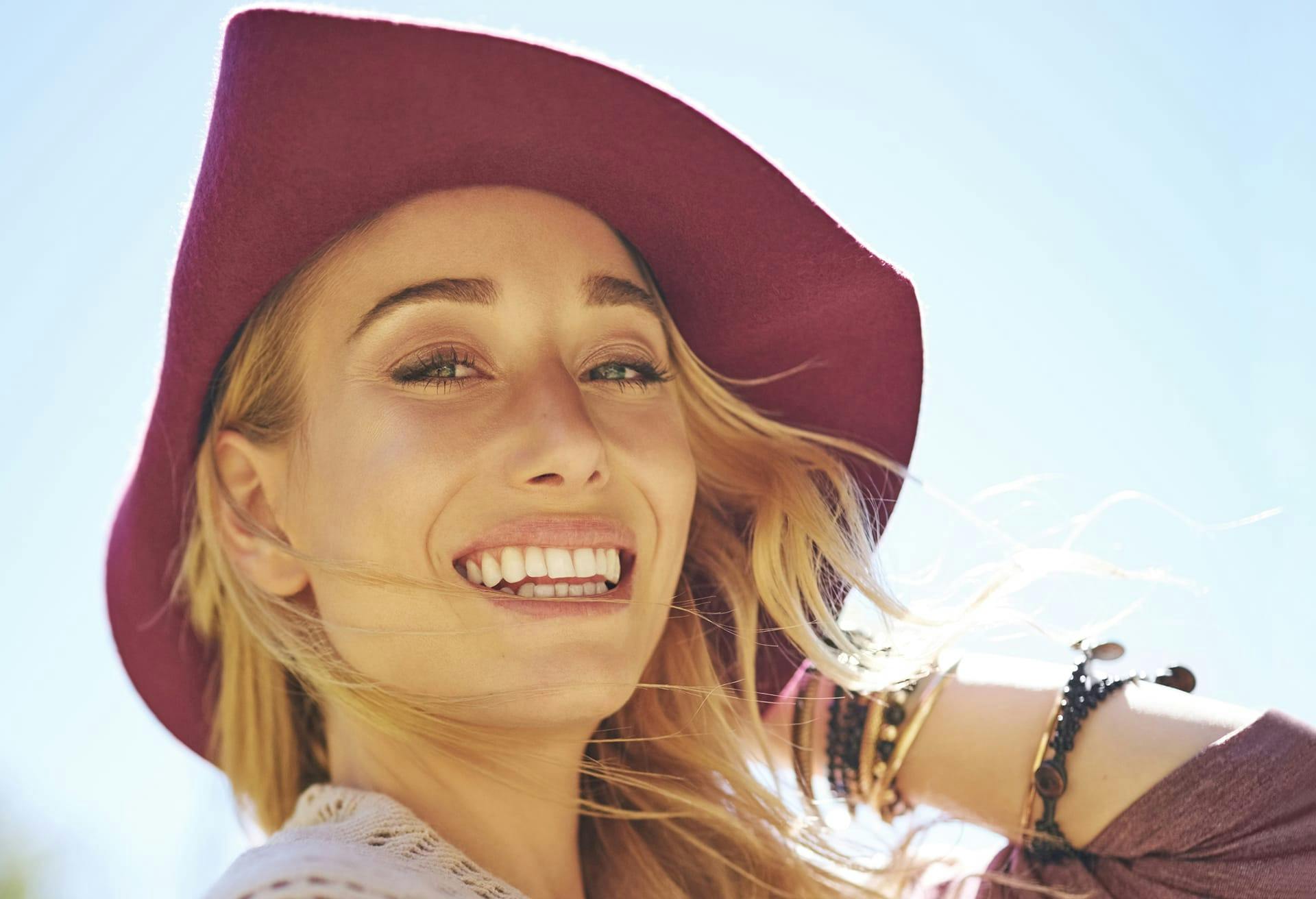 Woman in a sunhat smiling