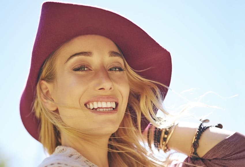 Woman in a sunhat smiling