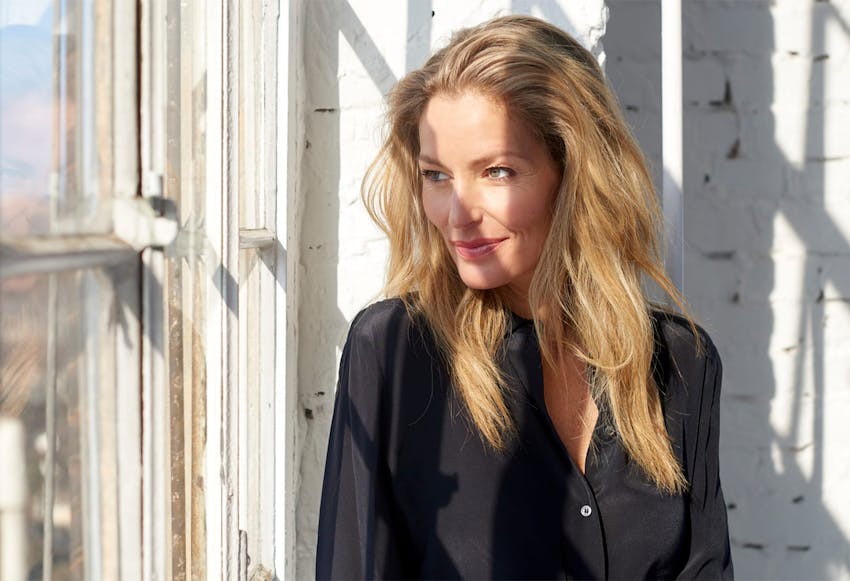 Older woman in a black blouse looking to side