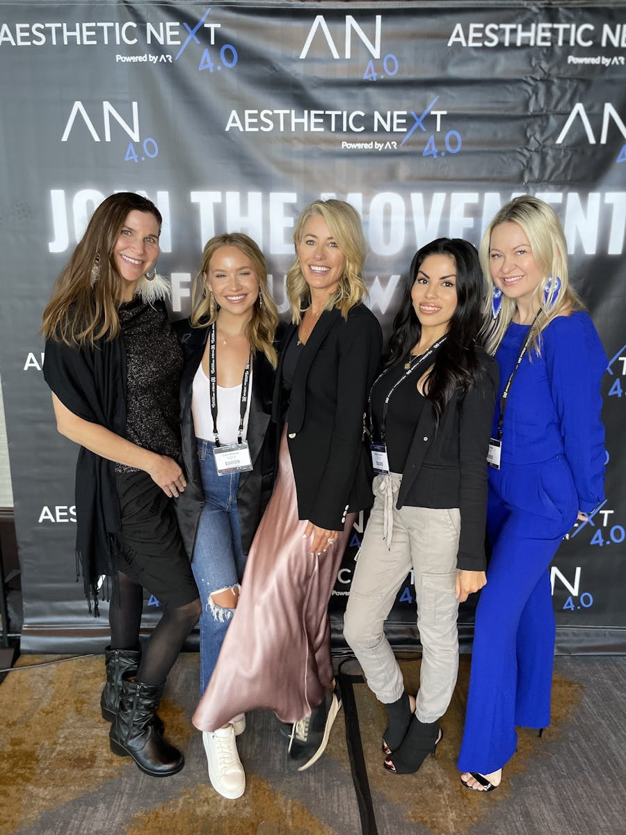 Saving Face Austin staff posing for a photo