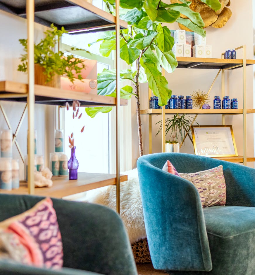 seating area with shelf of skincare