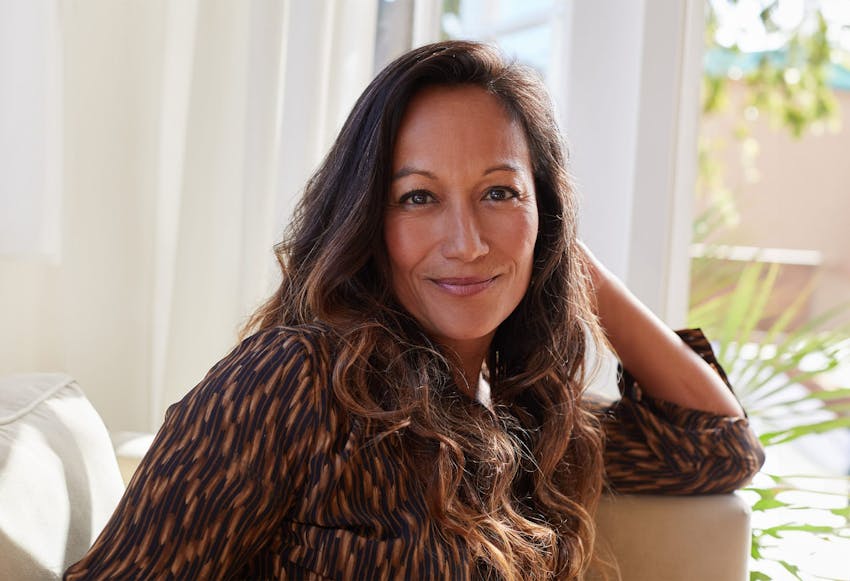 woman resting arm on chair head rest
