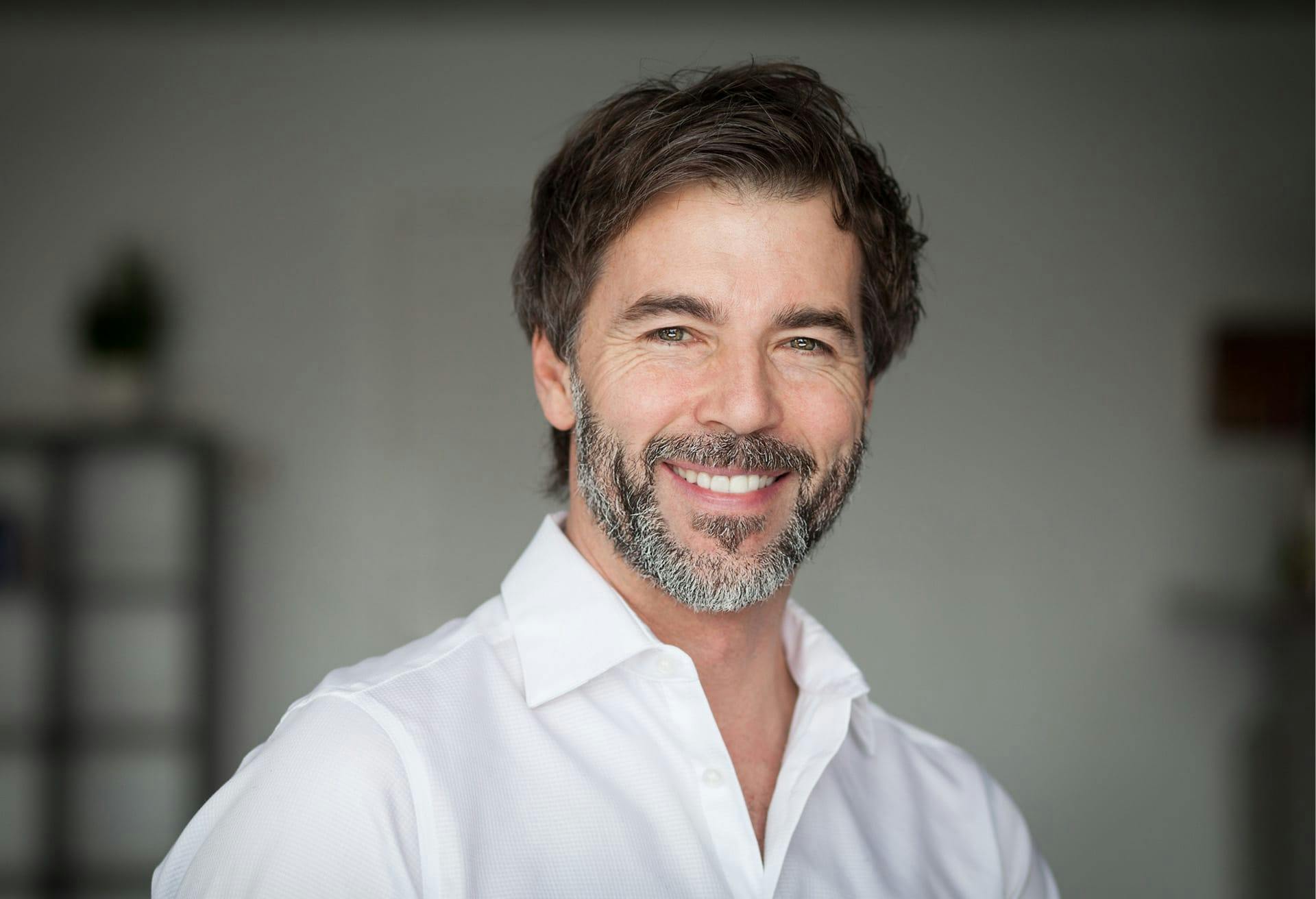man in white shirt smiling